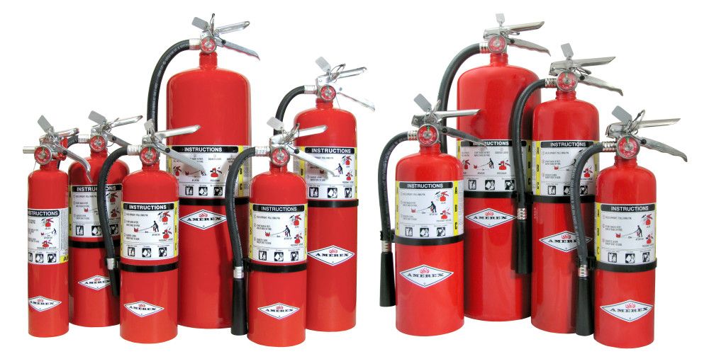 Certified technician servicing fire safety equipment